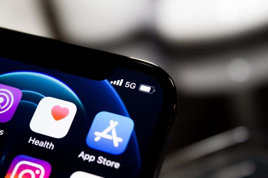 Close-up of a smartphone home screen crowded with app icons.
