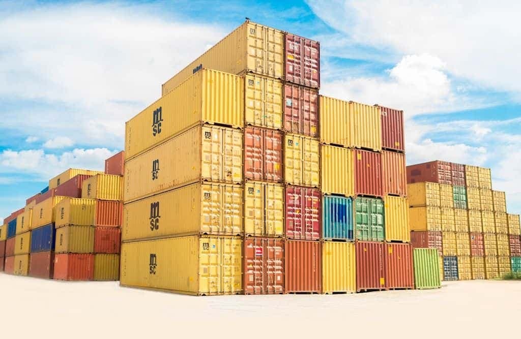 Rows of stacked, assorted-color intermodal shipping containers.