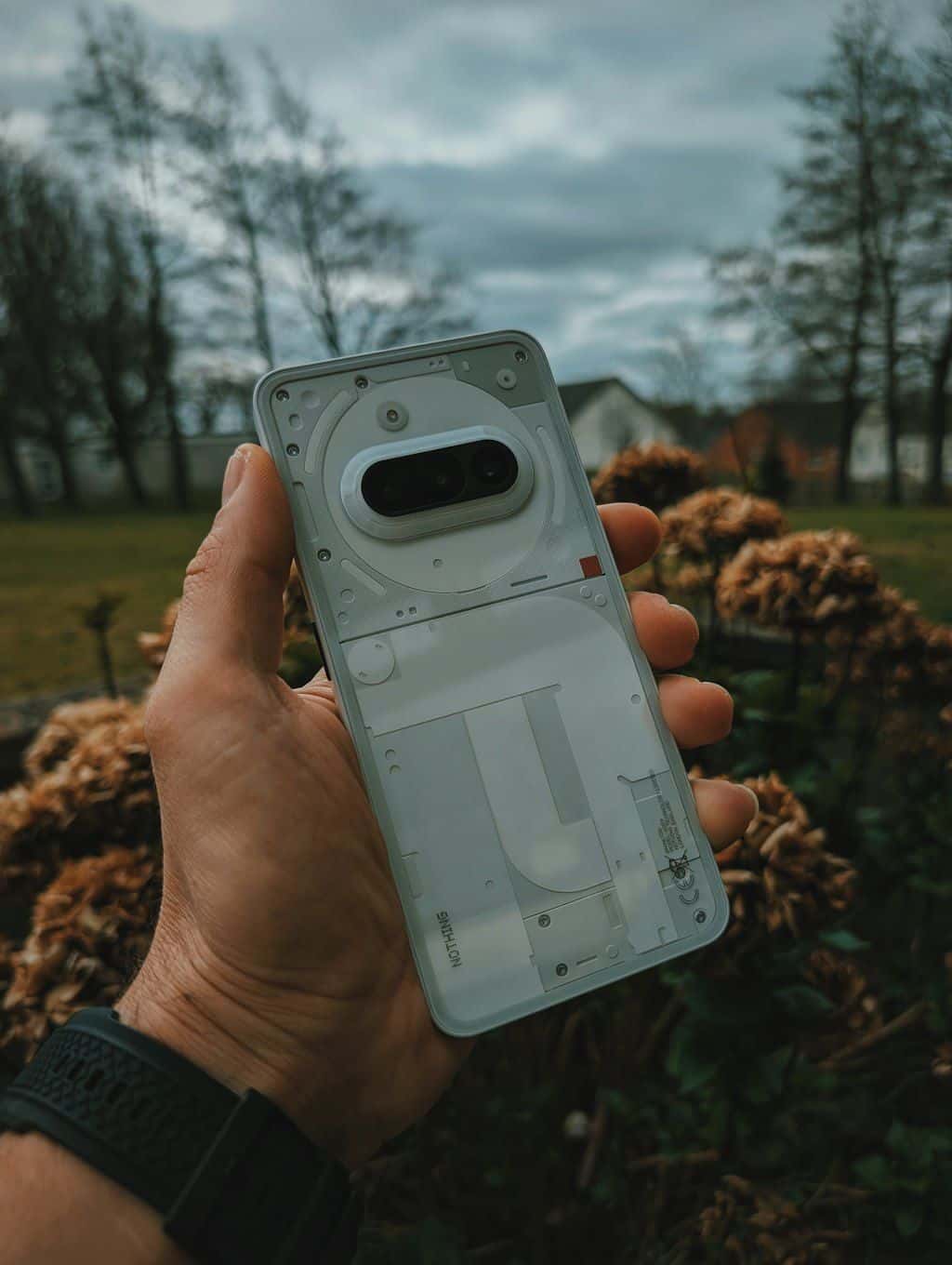 A hand holding a modern smartphone.